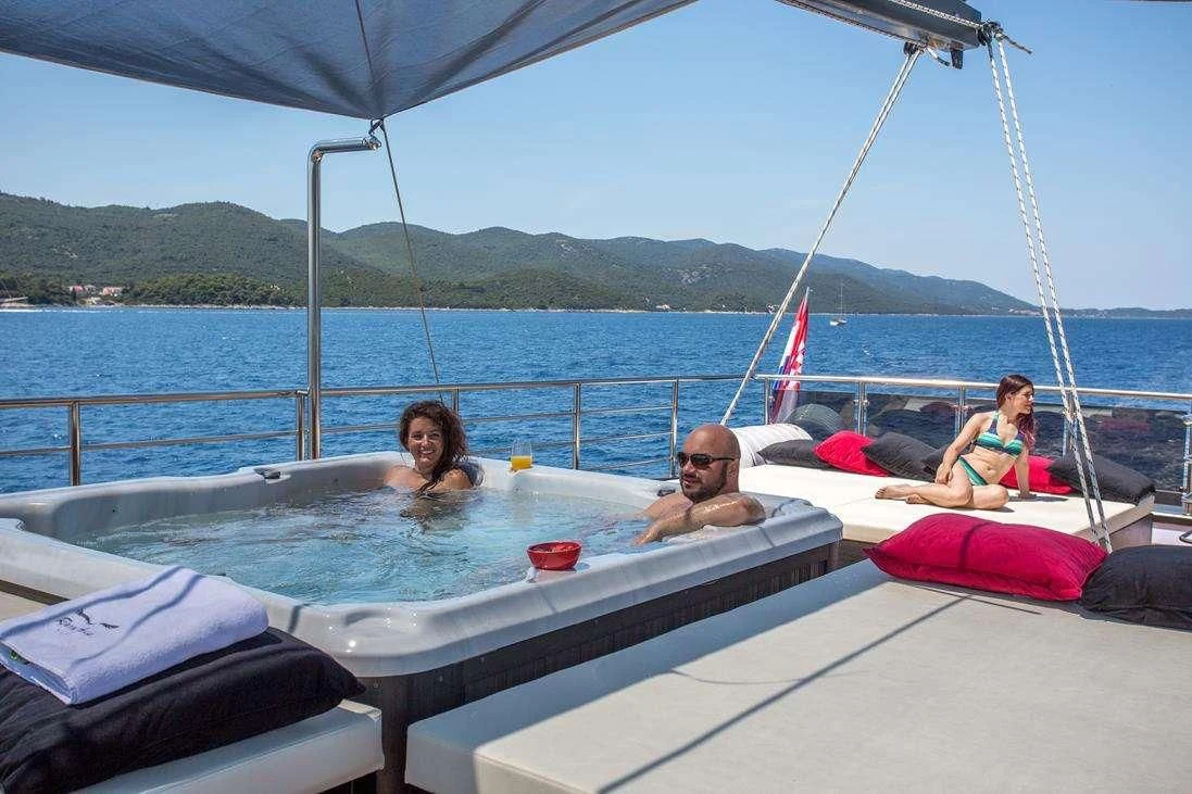 a group of people on a boat aboard RARA AVIS Yacht for Charter
