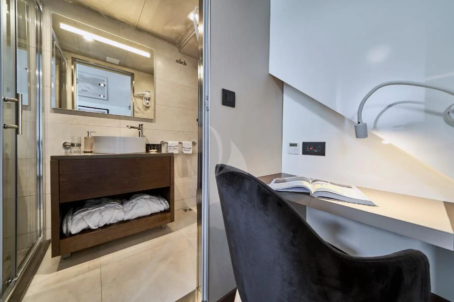 a bathroom with a sink and a mirror aboard RARA AVIS Yacht for Charter