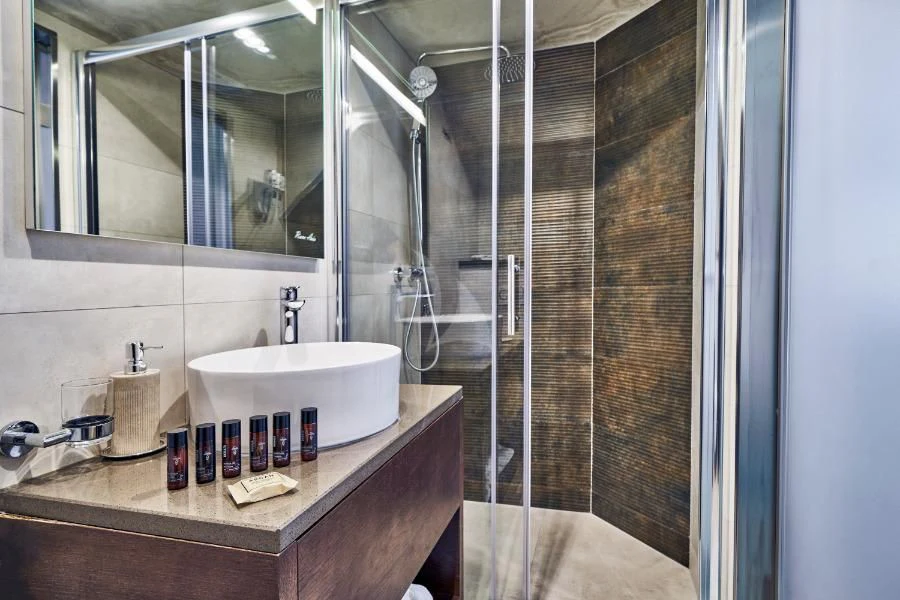 a bathroom with a glass shower aboard RARA AVIS Yacht for Charter