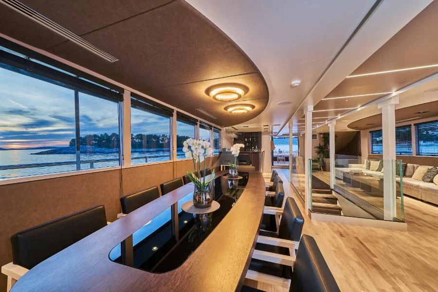 inside of a building with a table and chairs aboard RARA AVIS Yacht for Charter