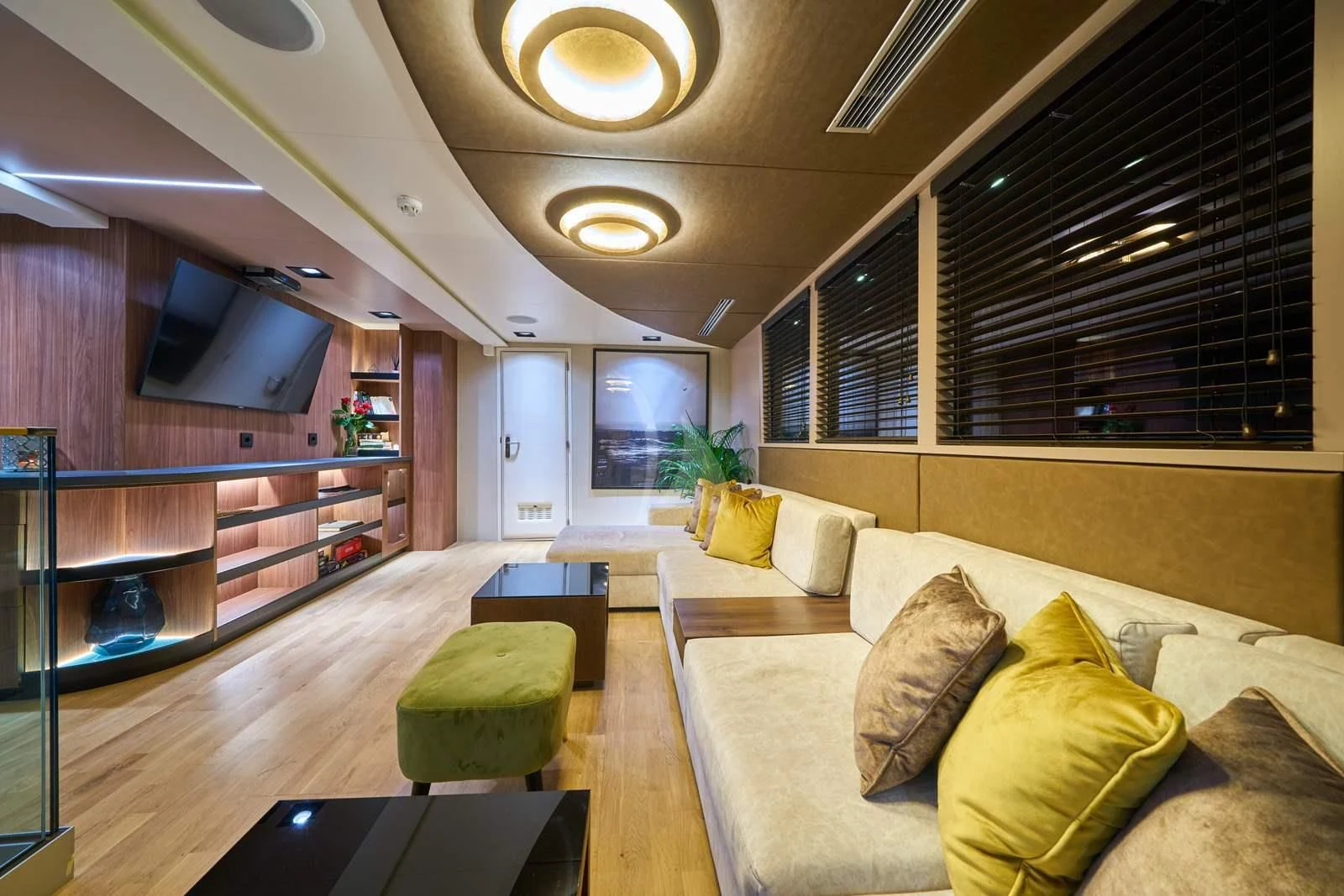 a living room with a couch and a tv aboard RARA AVIS Yacht for Charter