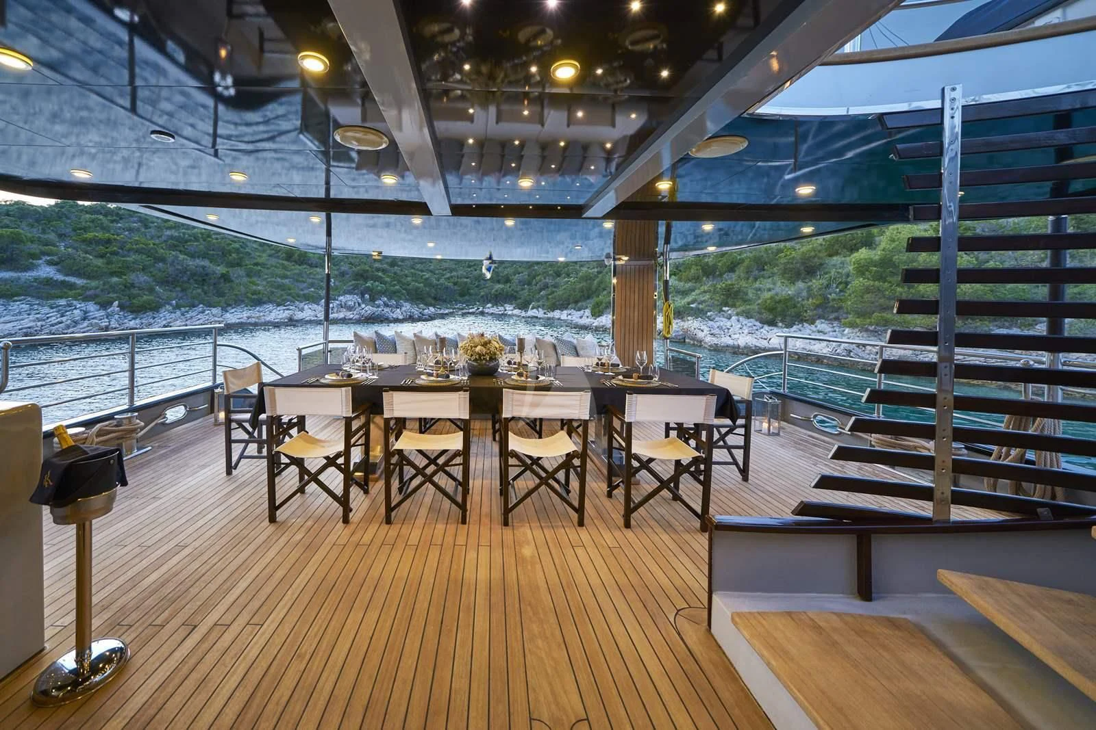 a room with a table and chairs aboard RARA AVIS Yacht for Charter