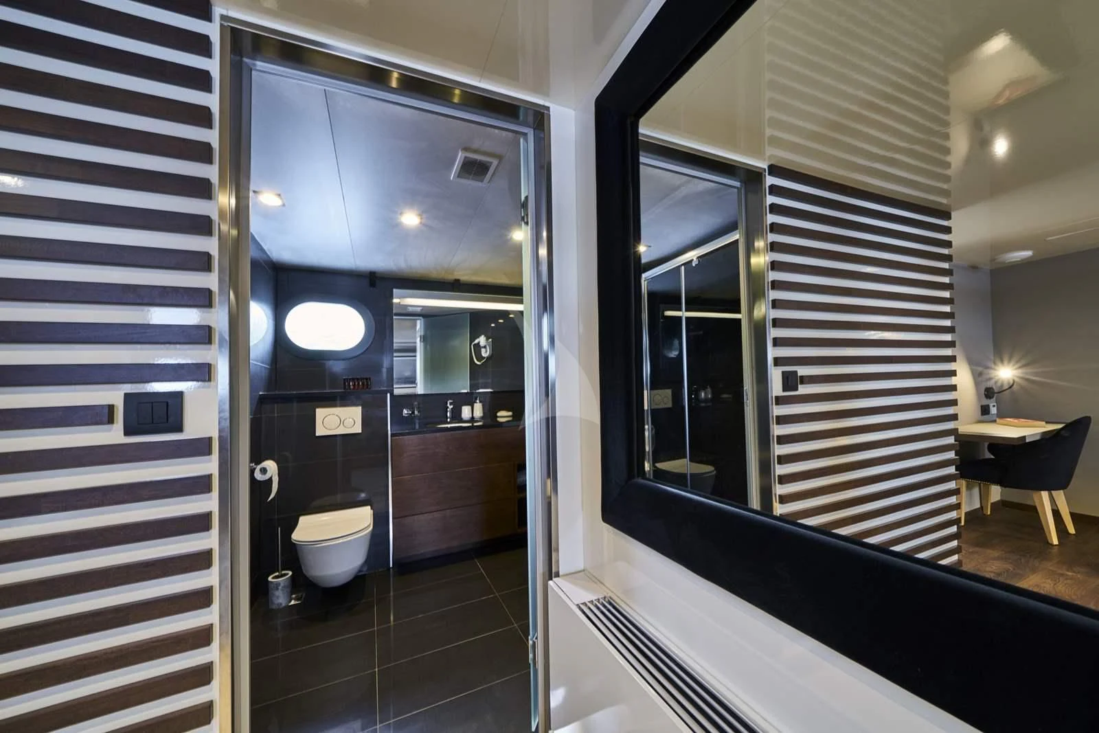 a bathroom with a glass door aboard RARA AVIS Yacht for Charter