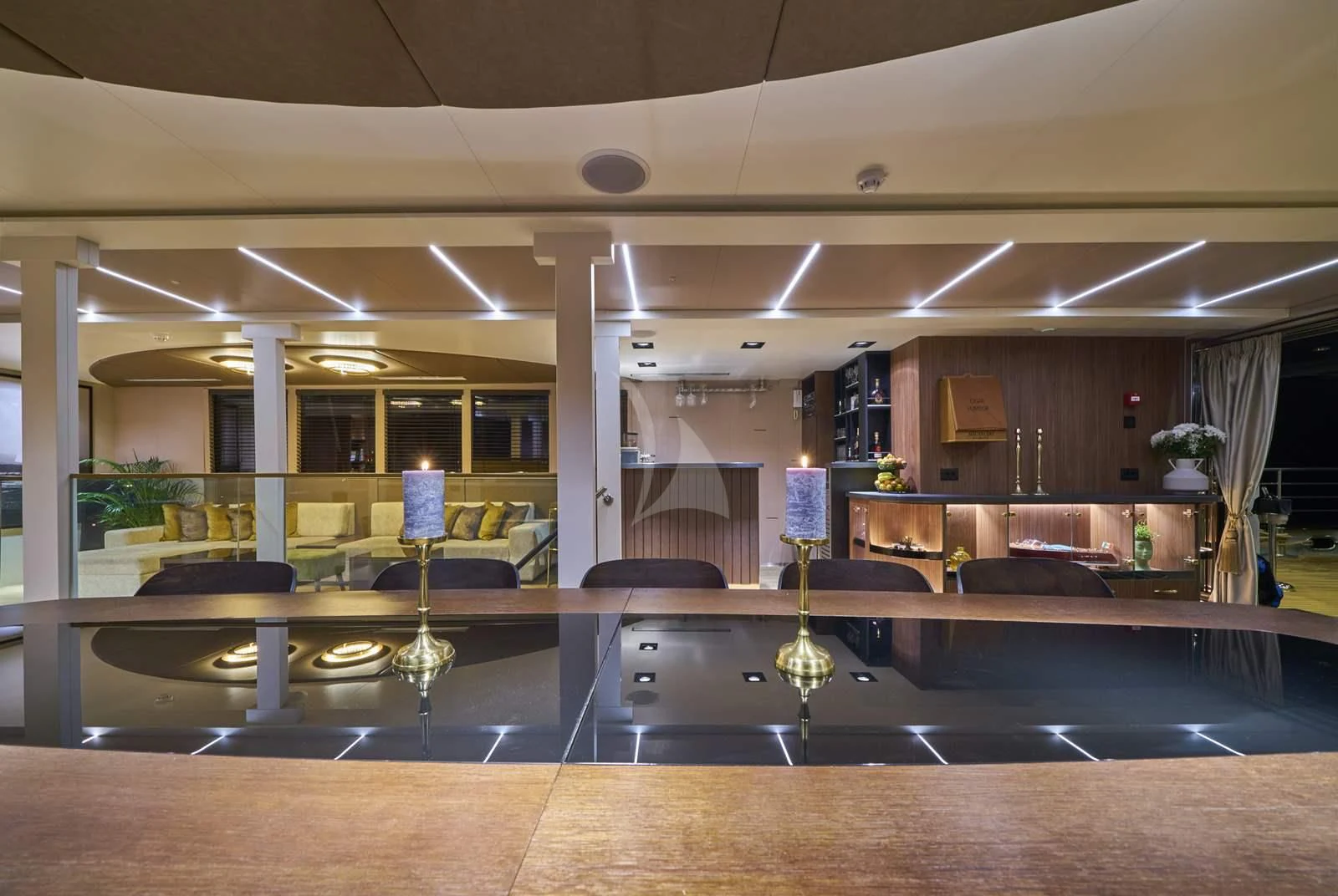 a large room with a table and chairs aboard RARA AVIS Yacht for Charter