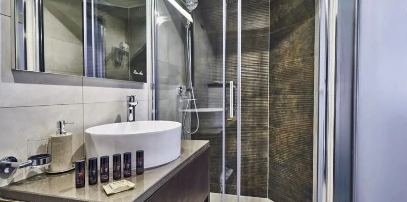 a bathroom with a sink and a shower aboard RARA AVIS Yacht for Charter