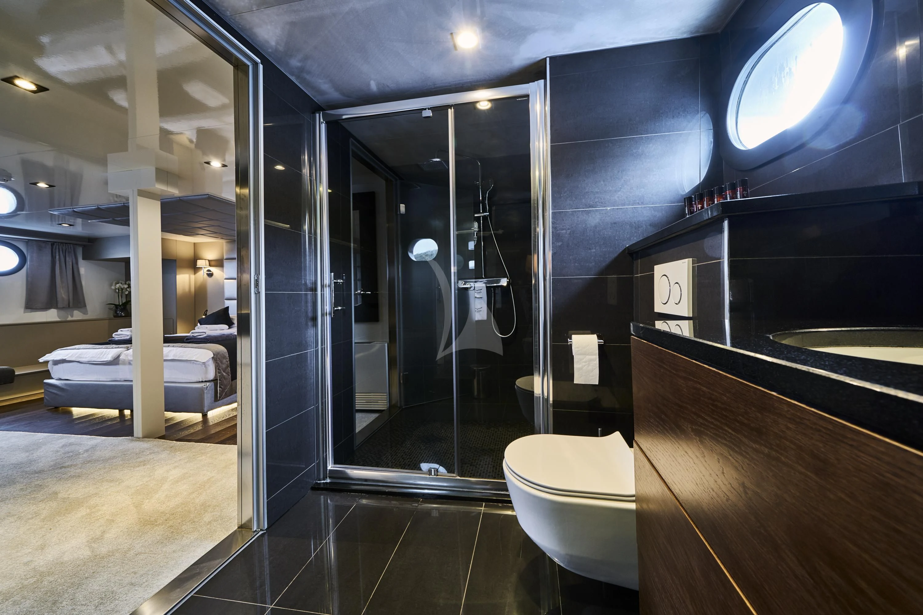 a bathroom with a glass shower aboard RARA AVIS Yacht for Charter