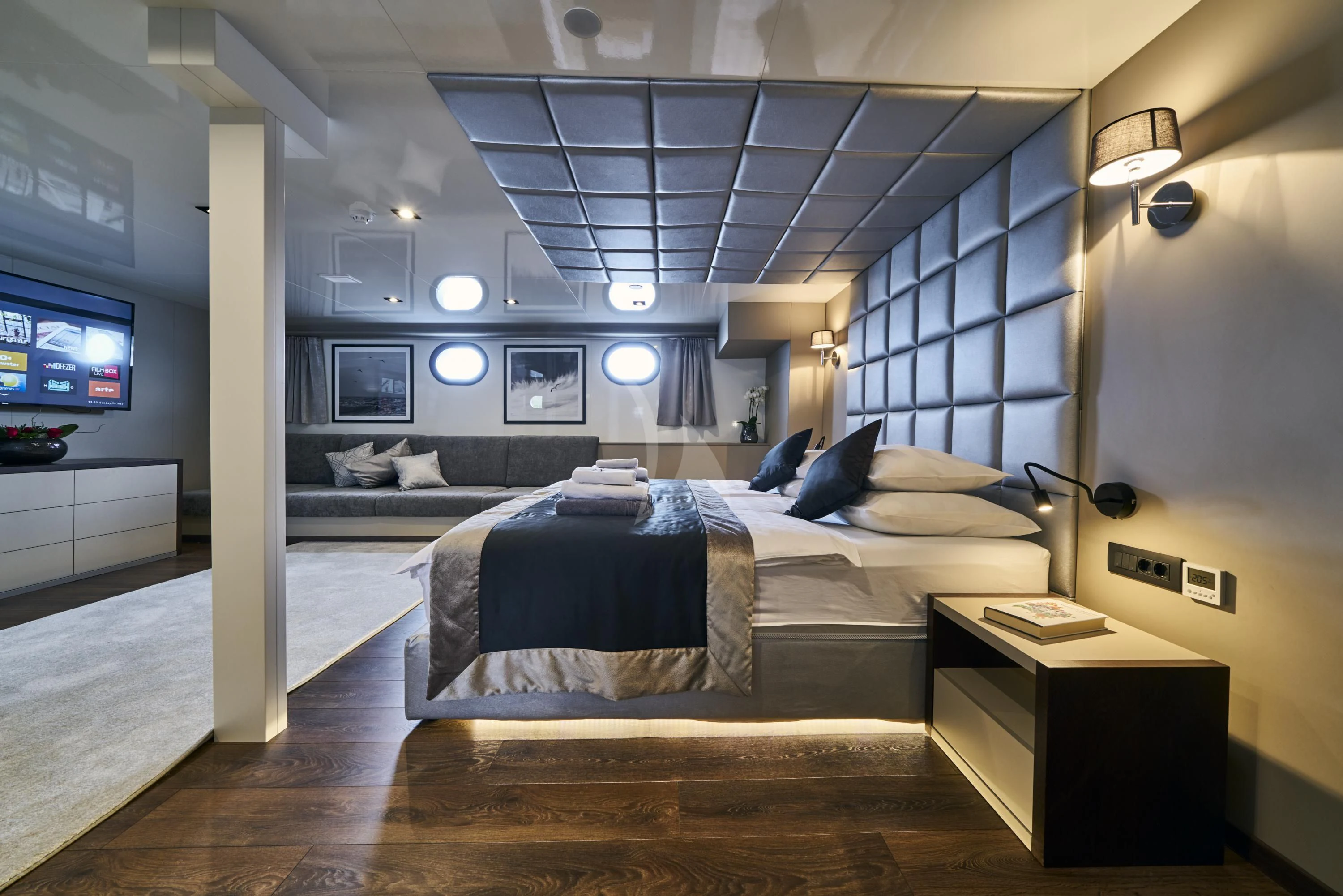 a room with a bed and a tv aboard RARA AVIS Yacht for Charter