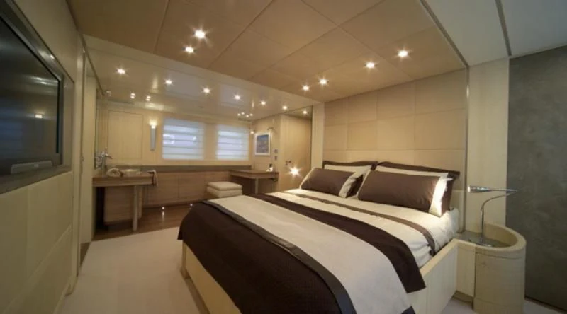 a large bedroom with a bed aboard EL DISPARO Yacht for Sale