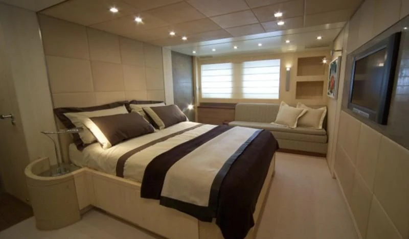 a bed in a room aboard EL DISPARO Yacht for Sale