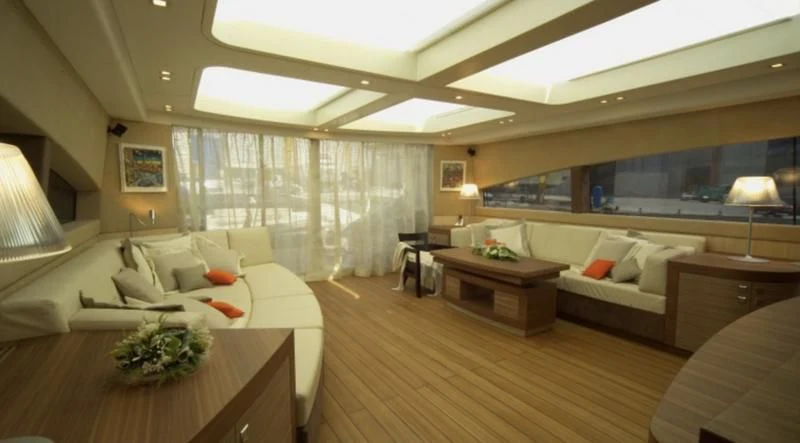 a living room with a large window aboard EL DISPARO Yacht for Sale