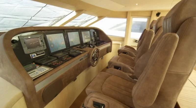 a car with a desk and computers aboard EL DISPARO Yacht for Sale