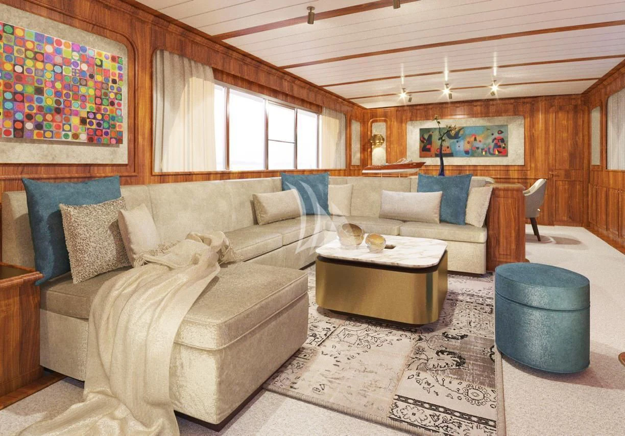 a living room with a couch and a table aboard A&A Yacht for Charter