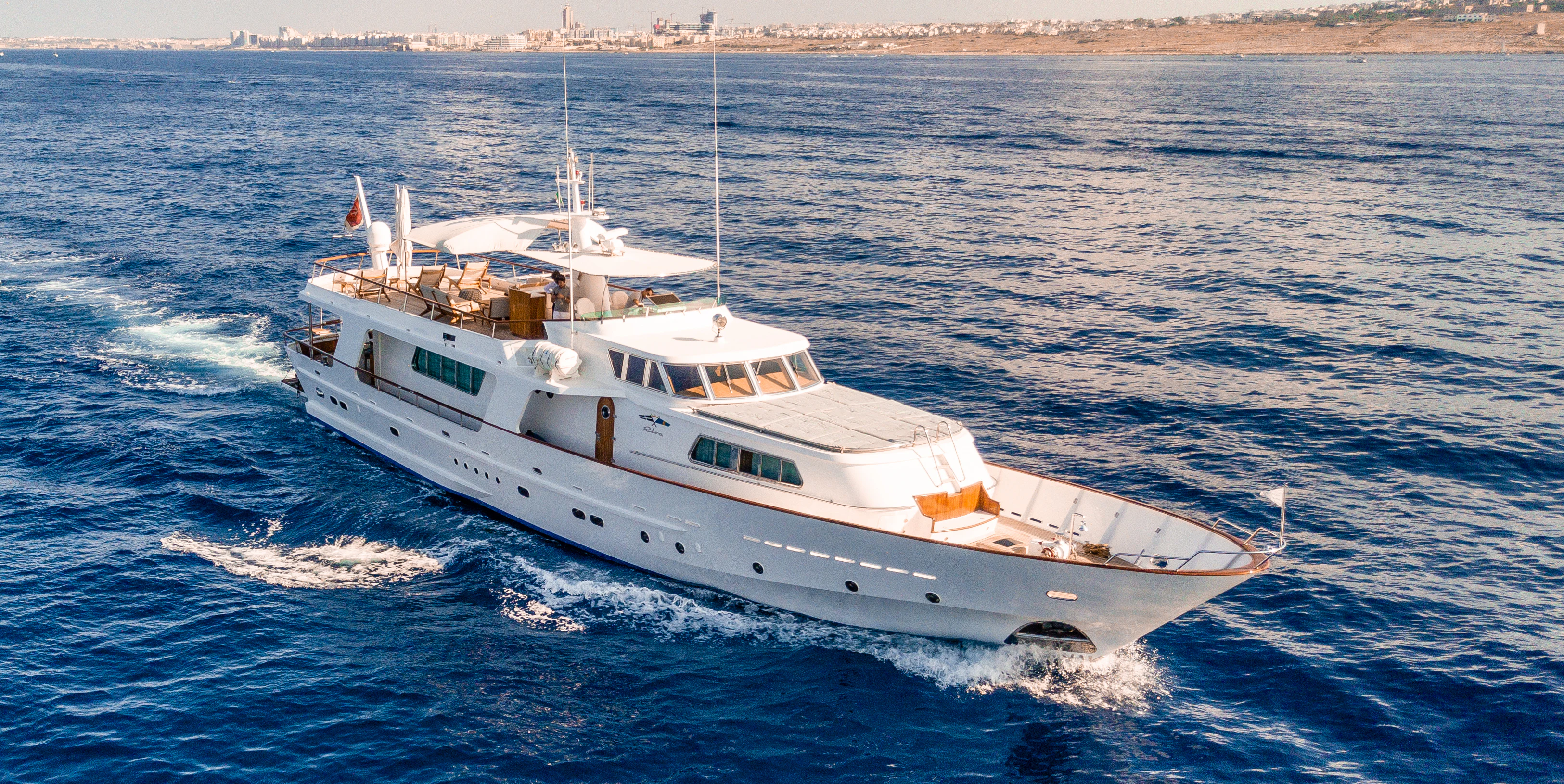 a large white ship aboard A&A Yacht for Charter