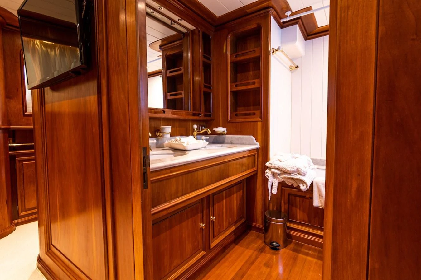 a bathroom with wooden cabinets aboard A&A Yacht for Charter