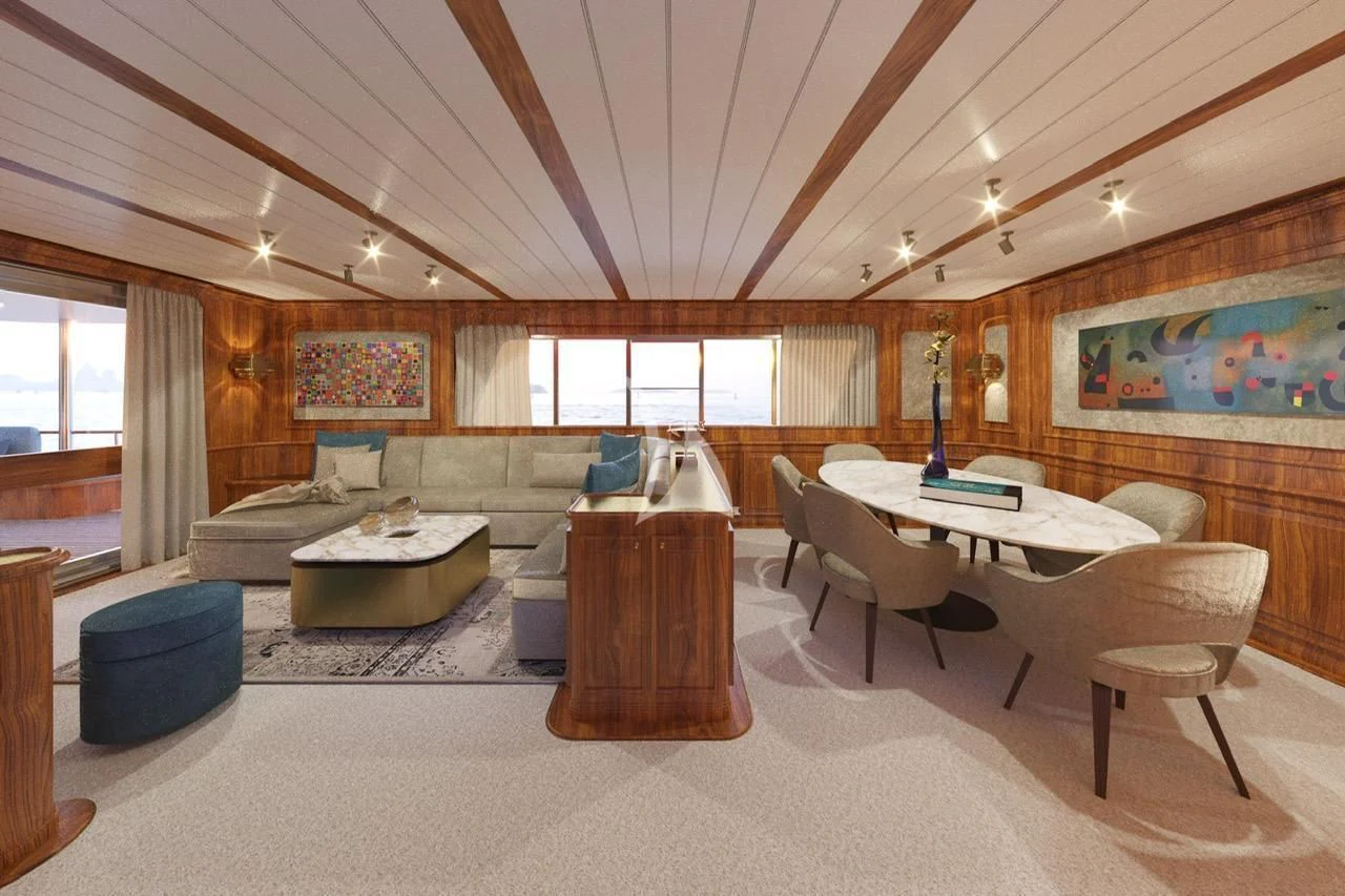 a large room with a table and chairs aboard A&A Yacht for Charter