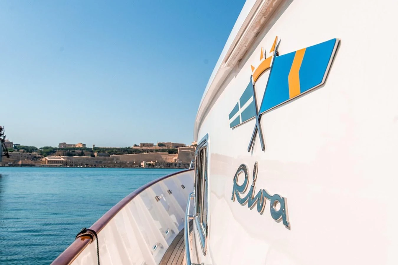 a boat with a flag on it aboard A&A Yacht for Charter