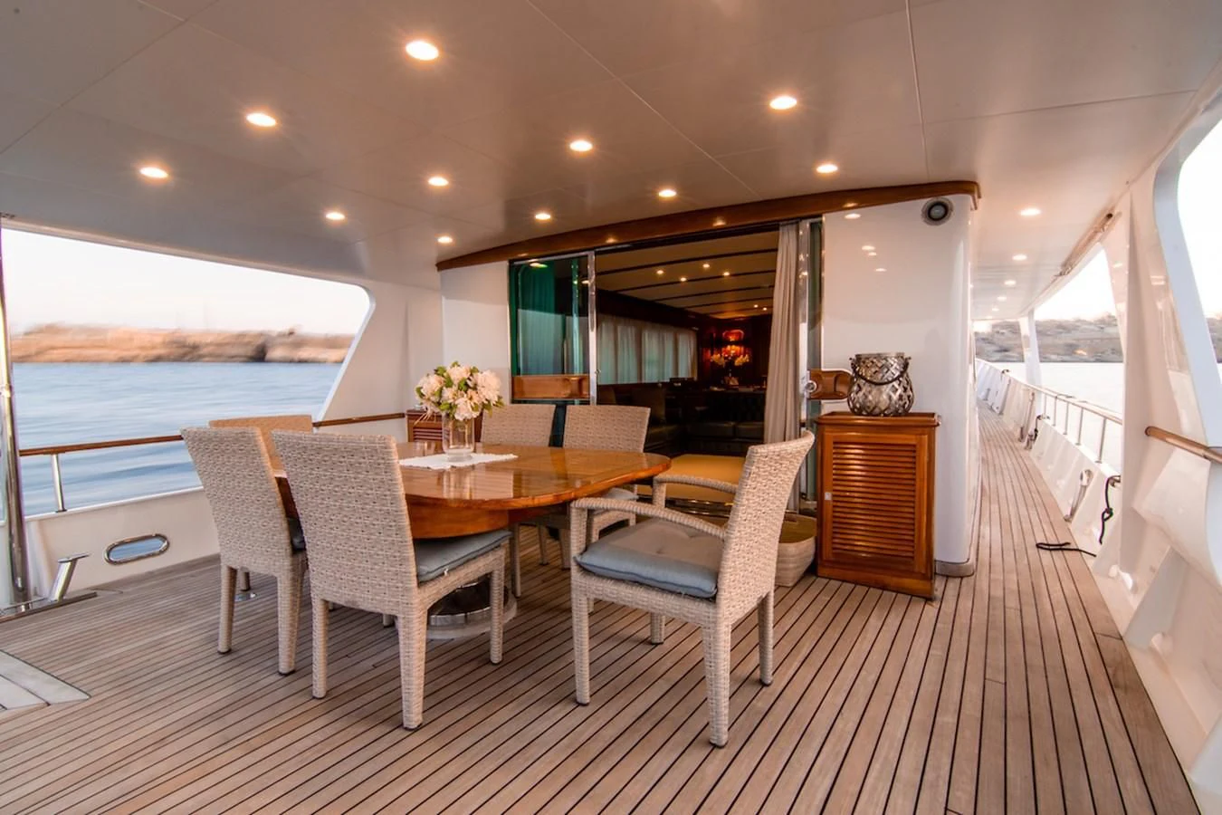 a dining room with a table and chairs aboard A&A Yacht for Charter