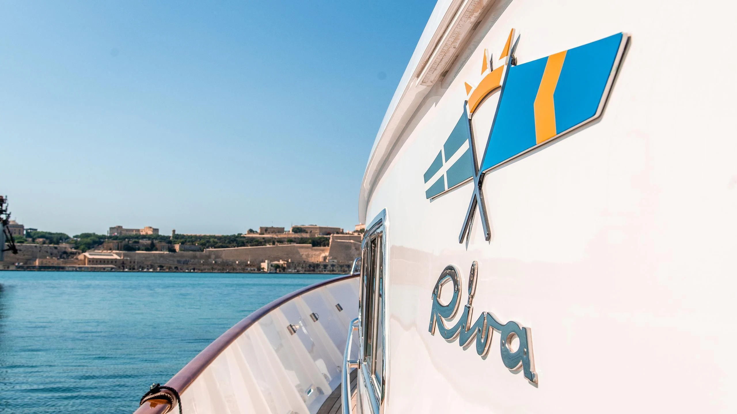 a boat with a flag on it aboard A&A Yacht for Charter