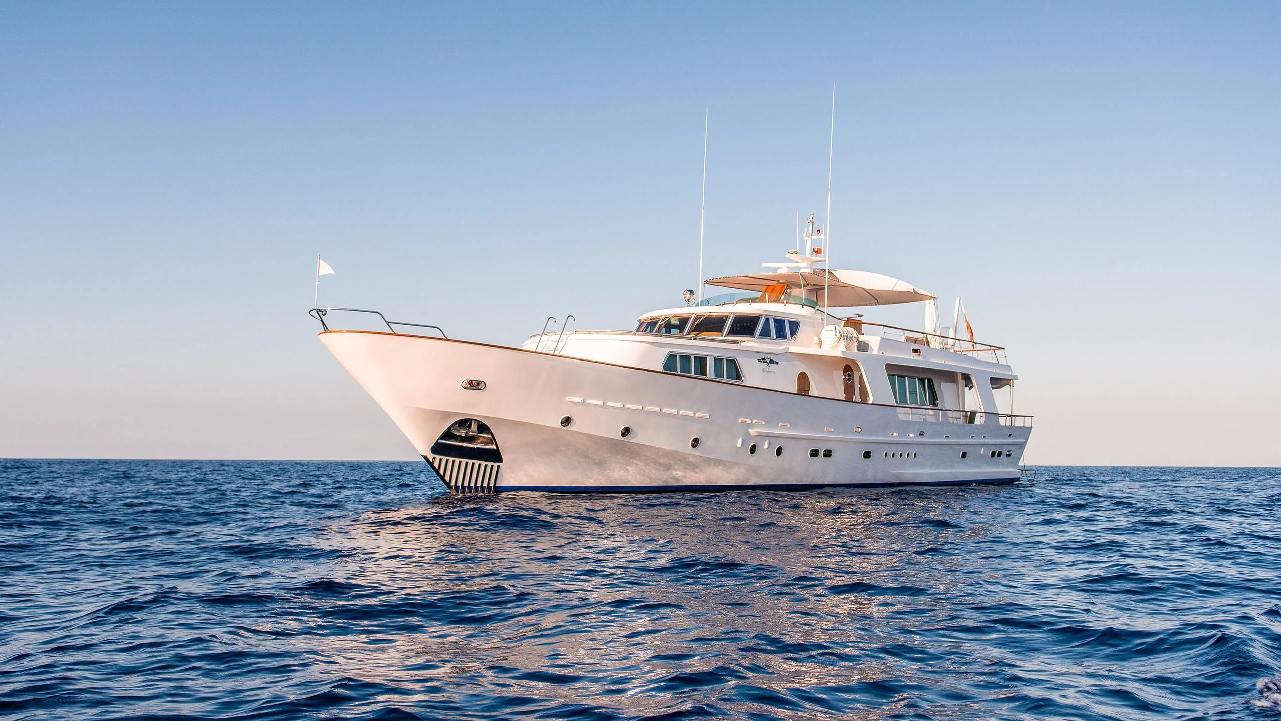 a white yacht in the water aboard A&A Yacht for Charter