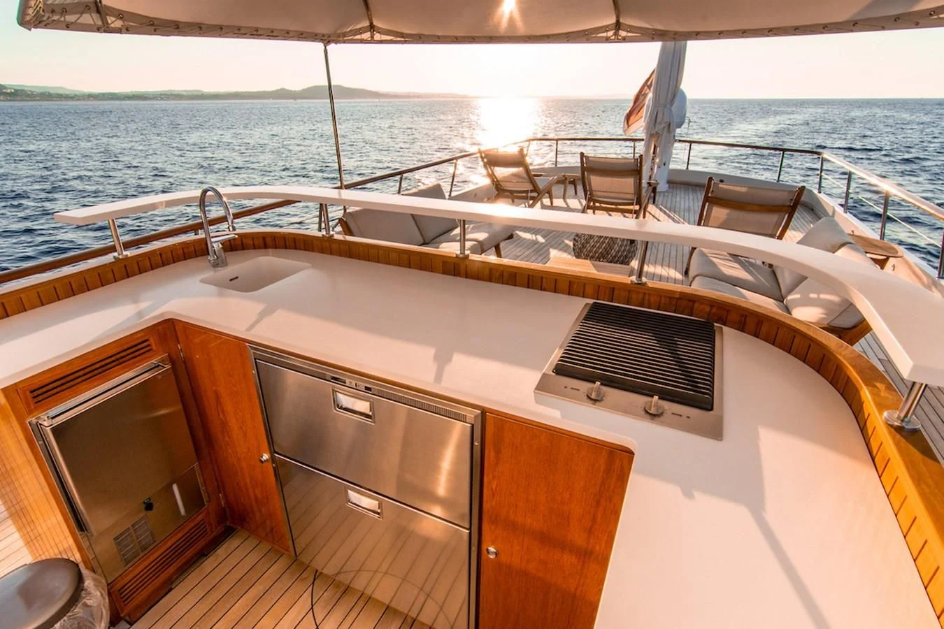 a boat with a sink and chairs on the deck aboard A&A Yacht for Charter