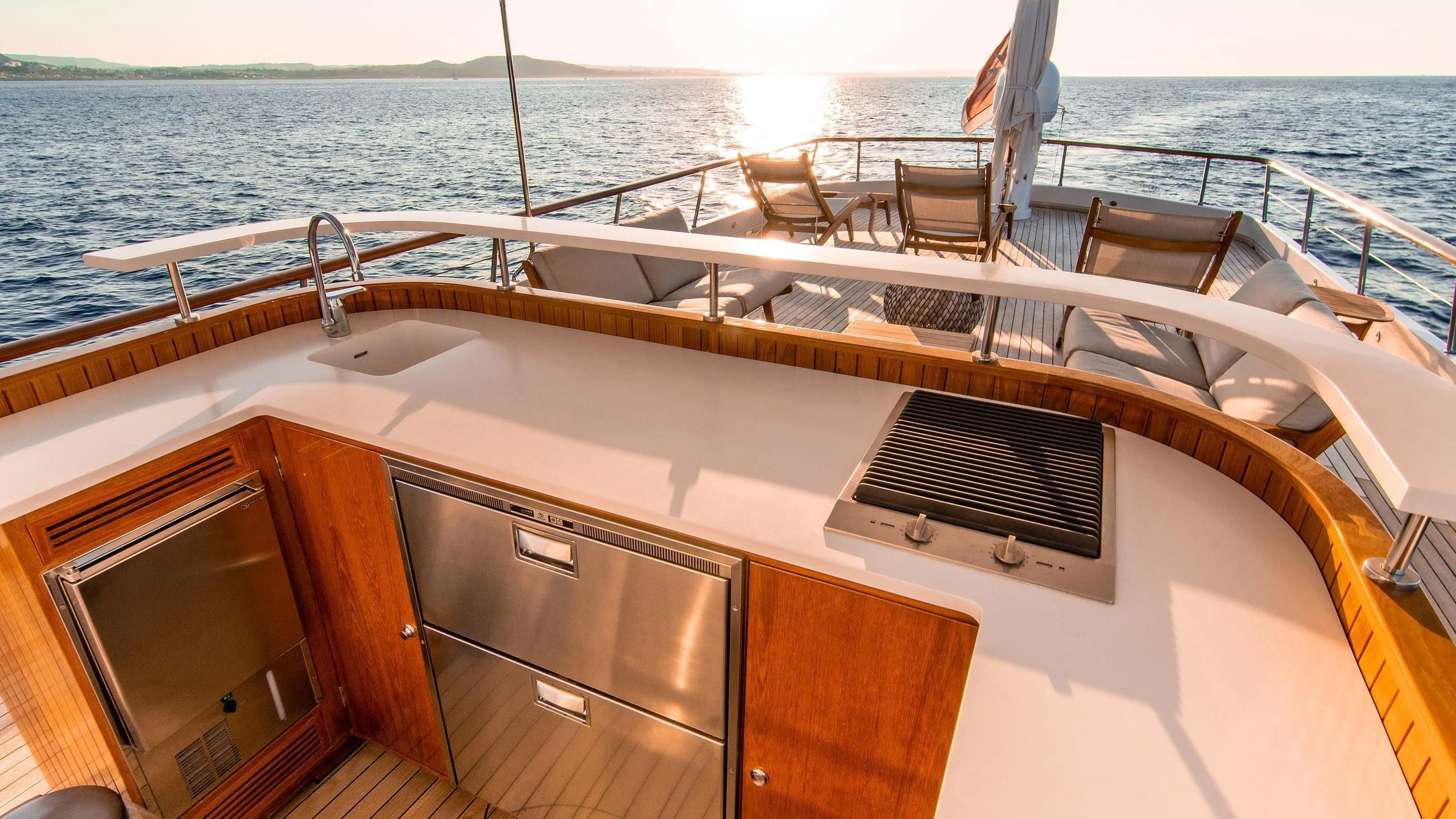 a boat with a sink and a bench on it aboard A&A Yacht for Charter