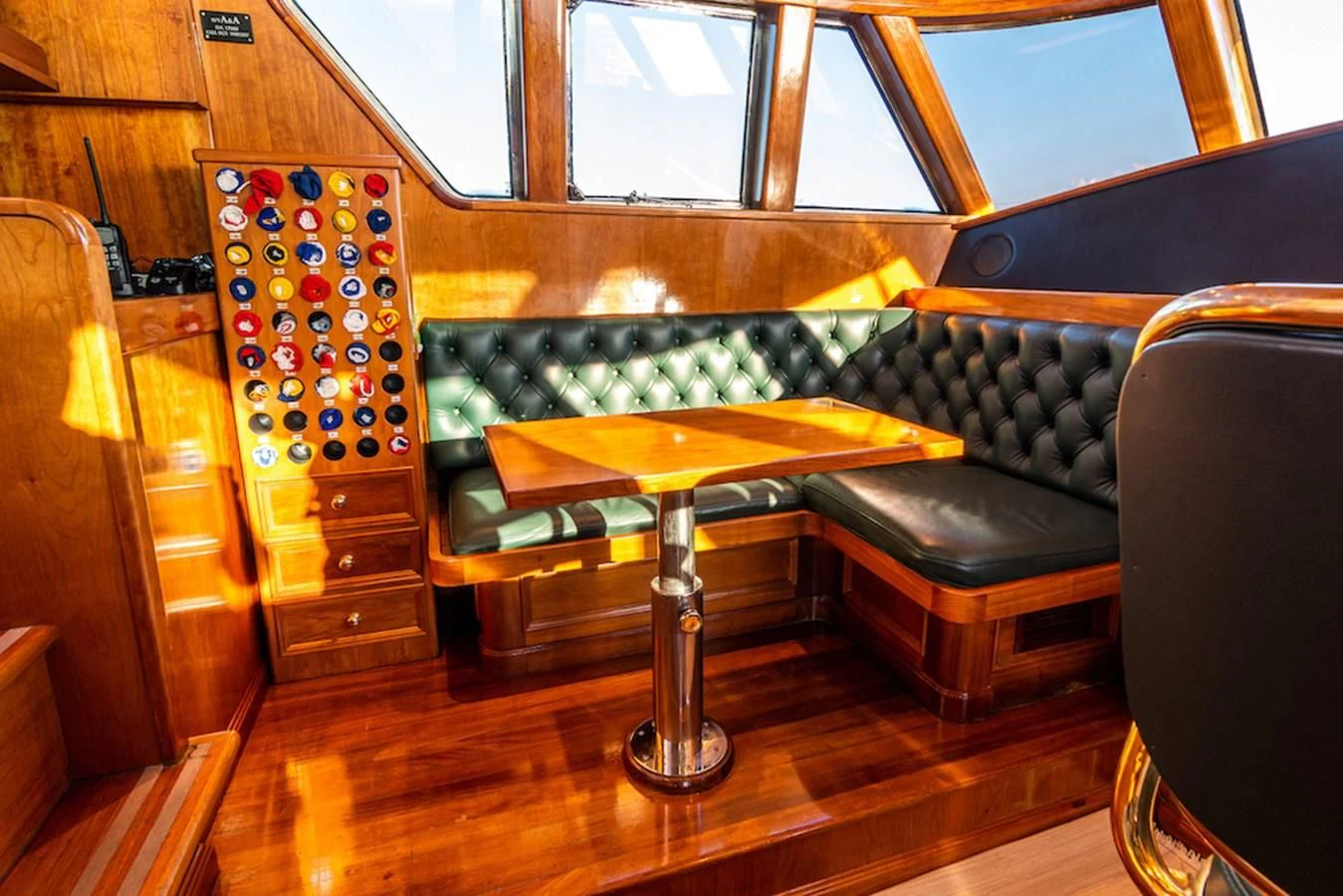 a room with a table and a chair aboard A&A Yacht for Charter