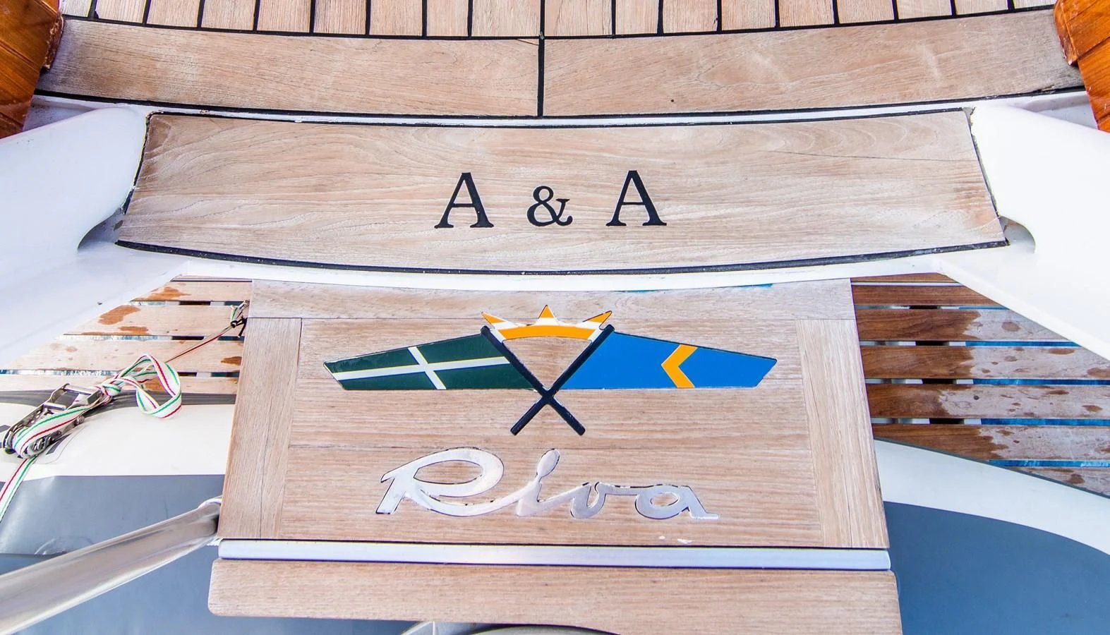 a wood table with a sign on it aboard A&A Yacht for Charter