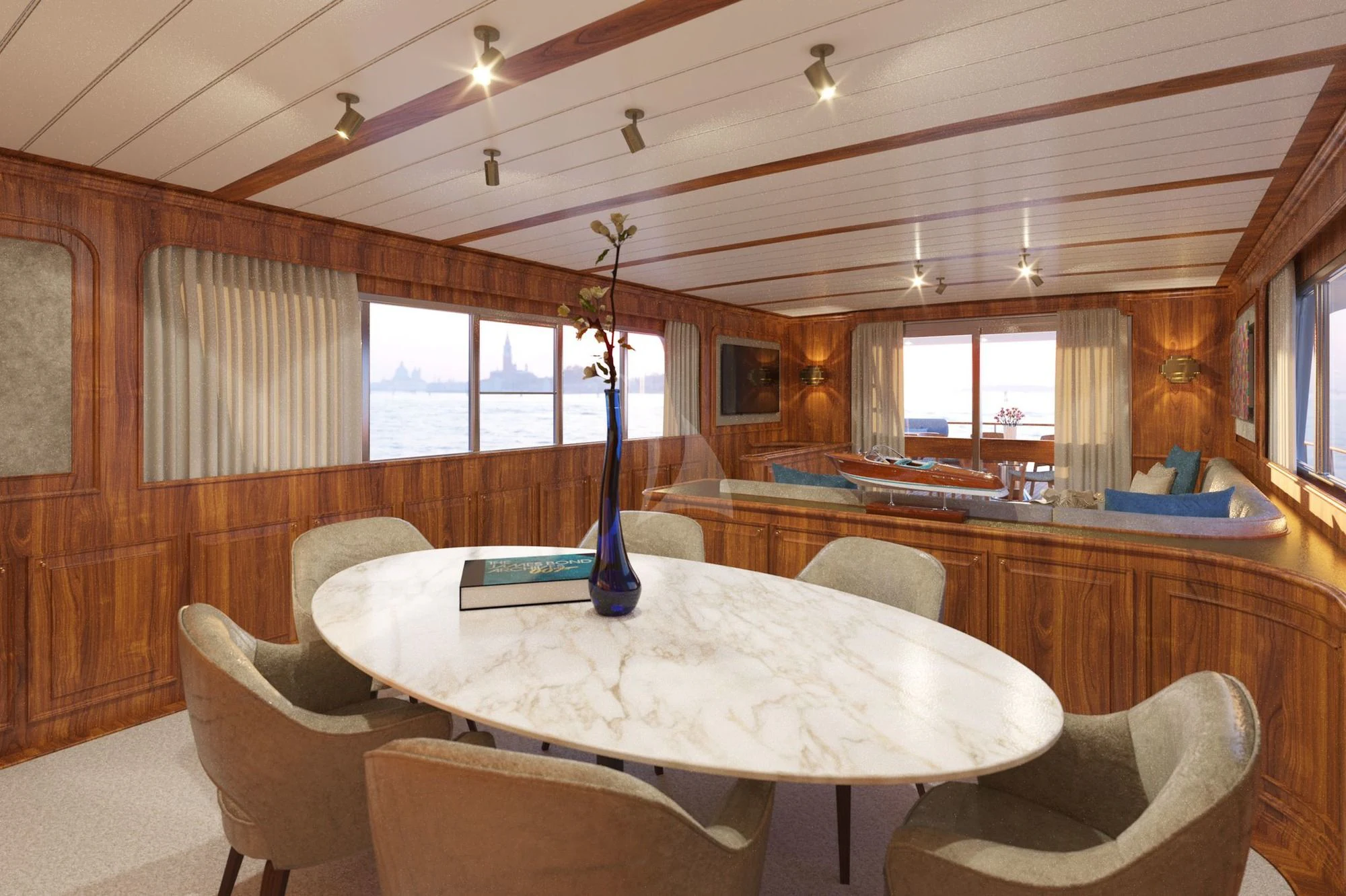 a room with a table chairs and a bed aboard A&A Yacht for Charter