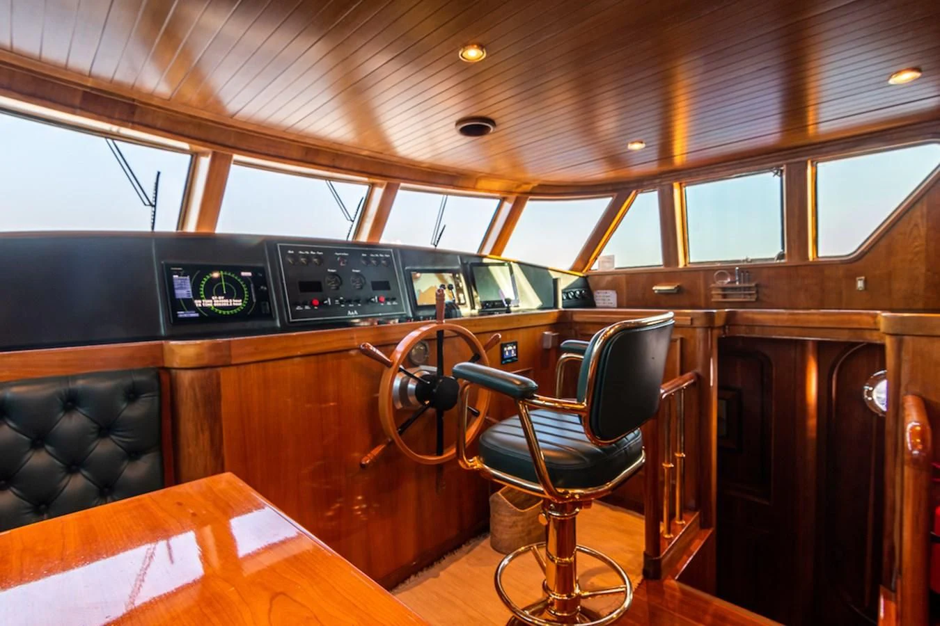 a wooden car with a seat aboard A&A Yacht for Charter