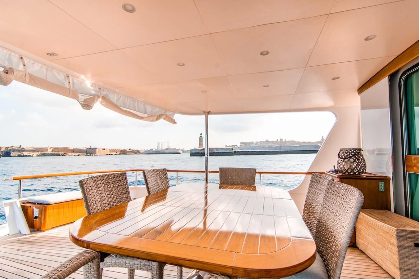 a table and chairs on a deck aboard A&A Yacht for Charter
