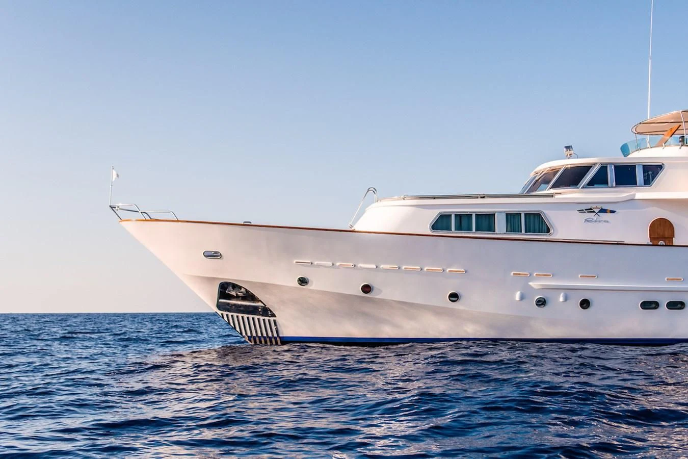 a white yacht in the water aboard A&A Yacht for Charter