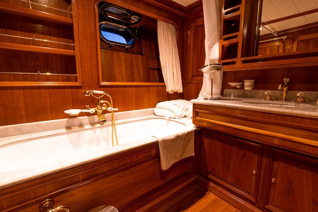 a bathroom with a bathtub and sink aboard A&A Yacht for Charter