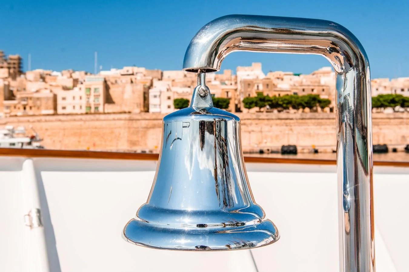 a water fountain with a city in the background aboard A&A Yacht for Charter