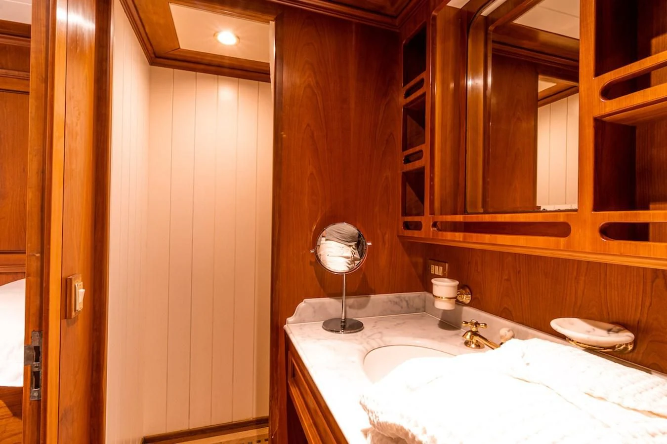 a bathroom with a sink and a mirror aboard A&A Yacht for Charter