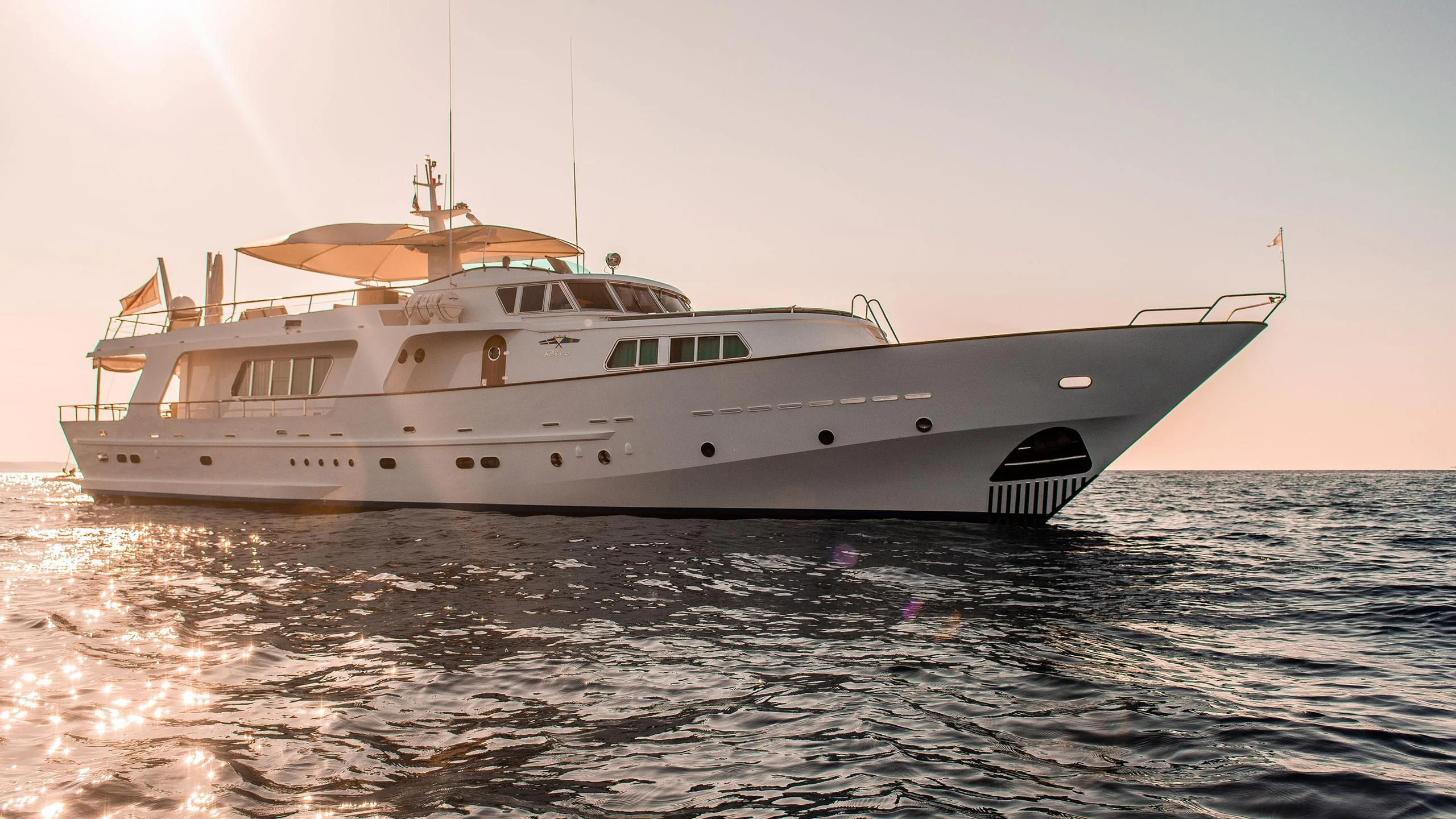 a white yacht in the water aboard A&A Yacht for Charter