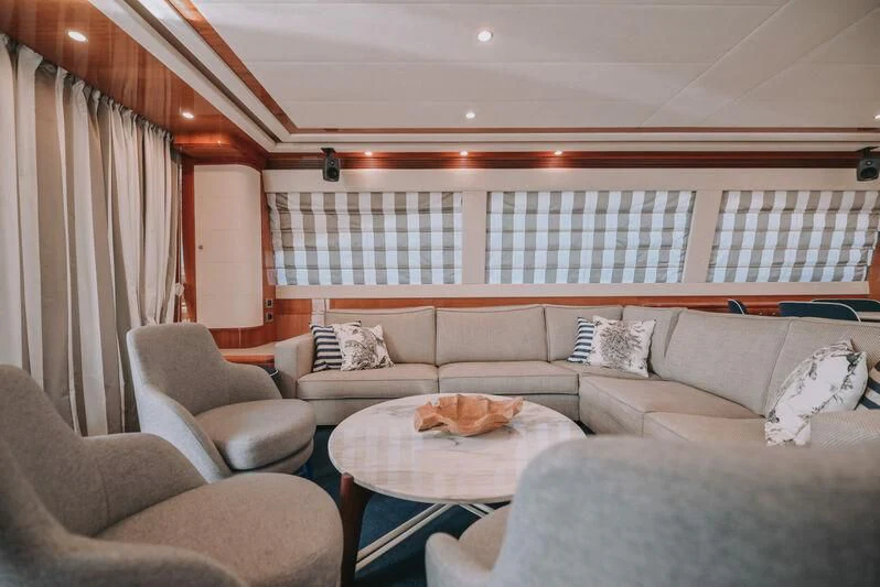 a living room with a couch and a table aboard SEA YOU Yacht for Sale