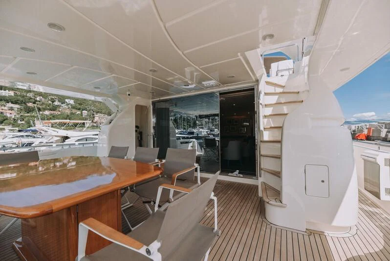 a room with tables and chairs aboard SEA YOU Yacht for Sale
