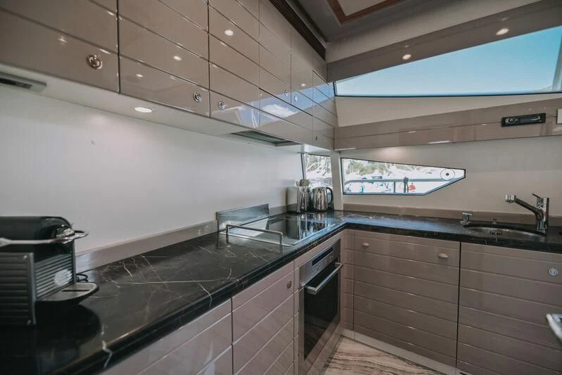 a kitchen with a large island aboard SEA YOU Yacht for Sale