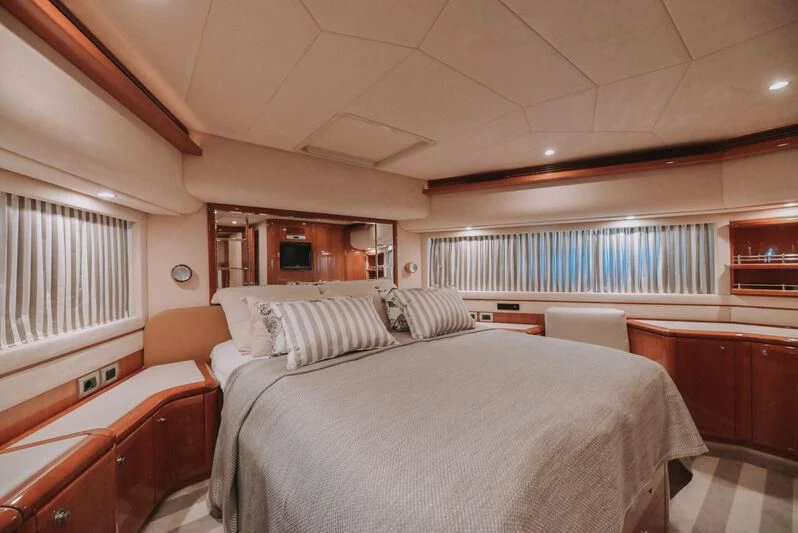 a room with a bed and a window aboard SEA YOU Yacht for Sale