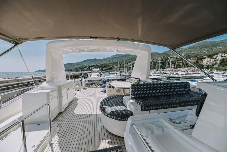 a deck with a view of a city and a large body of water aboard SEA YOU Yacht for Sale