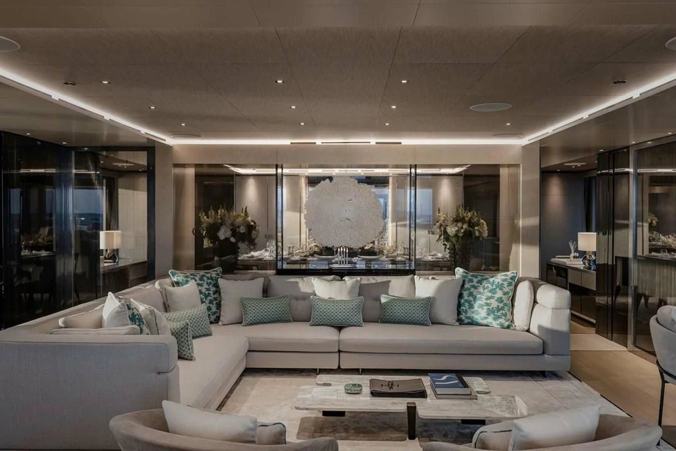 a living room with a large sofa aboard LEMON TREE Yacht for Charter