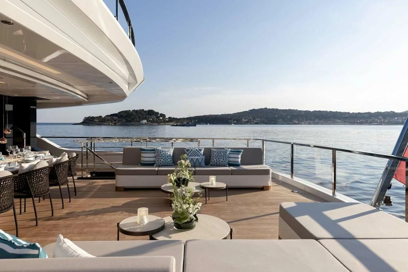 a patio with a table and chairs aboard LEMON TREE Yacht for Charter