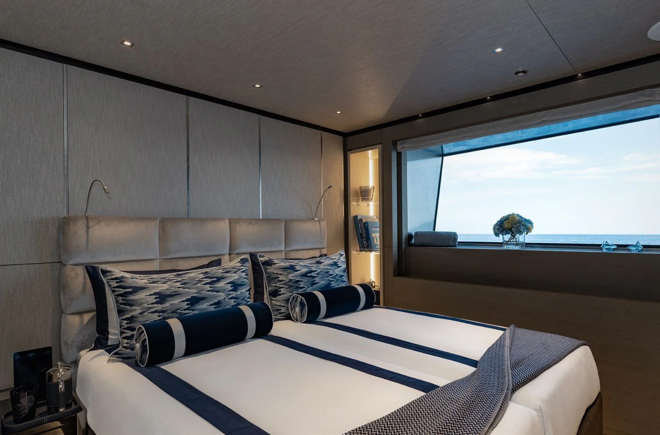 a room with a bed and a window aboard LEMON TREE Yacht for Charter