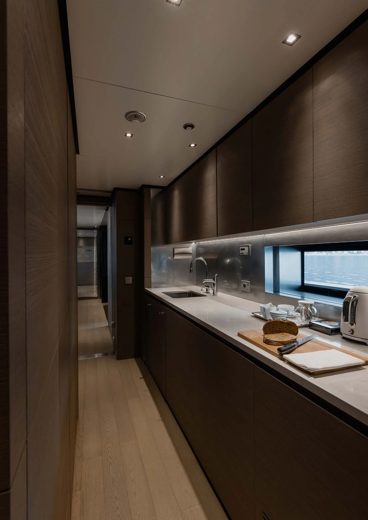 a kitchen with a large island aboard LEMON TREE Yacht for Charter