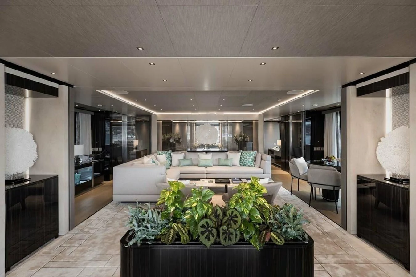 a living room with a large glass door aboard LEMON TREE Yacht for Charter