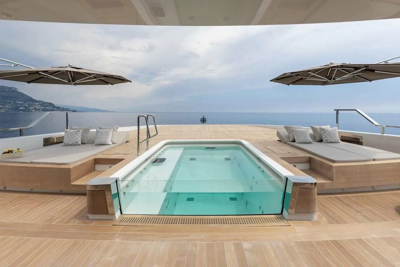 a pool on a deck overlooking the ocean aboard LEMON TREE Yacht for Charter