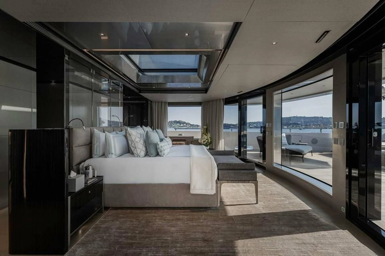 a large bedroom with a large glass door aboard LEMON TREE Yacht for Charter