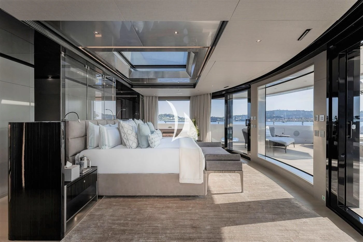 a room with a bed and a large window aboard LEMON TREE Yacht for Charter