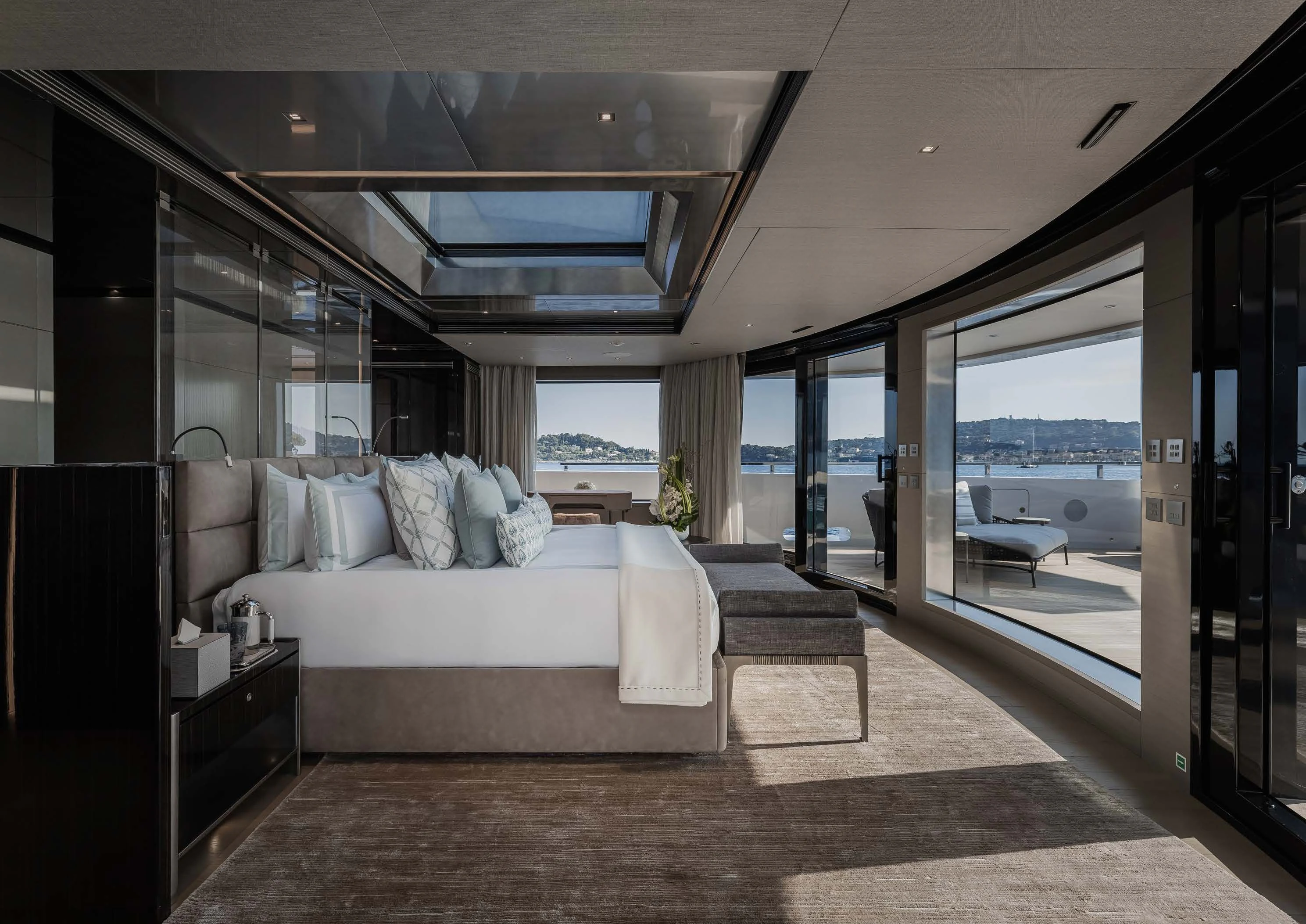 a large bedroom with a large glass door aboard LEMON TREE Yacht for Charter