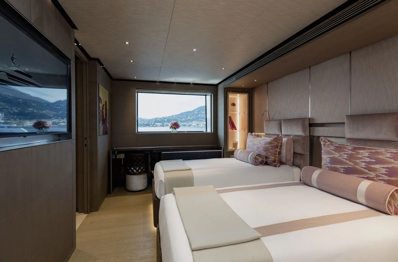 a room with a bed and a tv aboard LEMON TREE Yacht for Charter